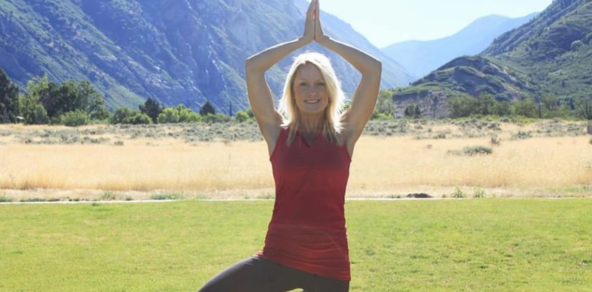Senior yoga class with participants doing gentle stretching