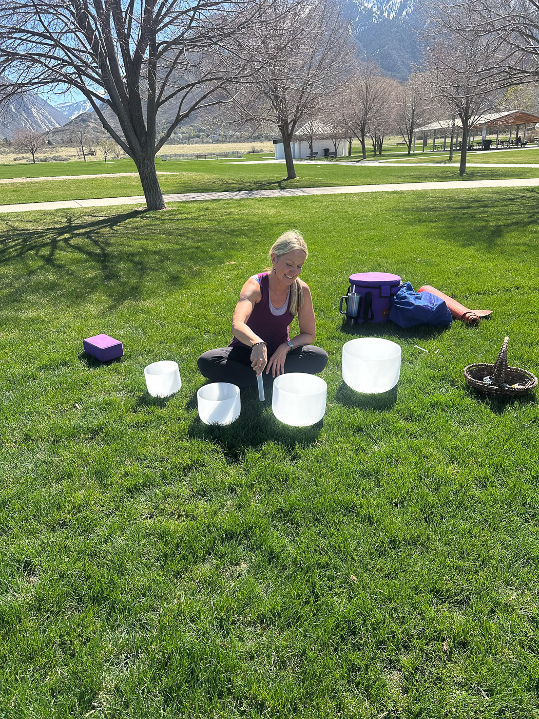 Outdoor sound bath session with crystal singing bowls in the mountains.
